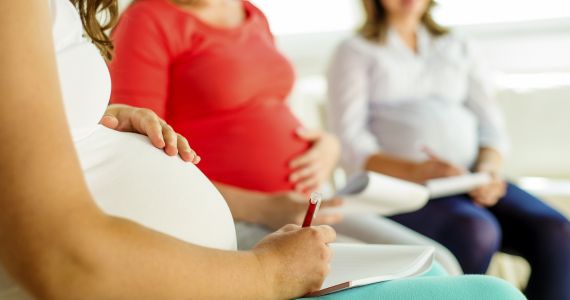 three pregnant women in a waiting room